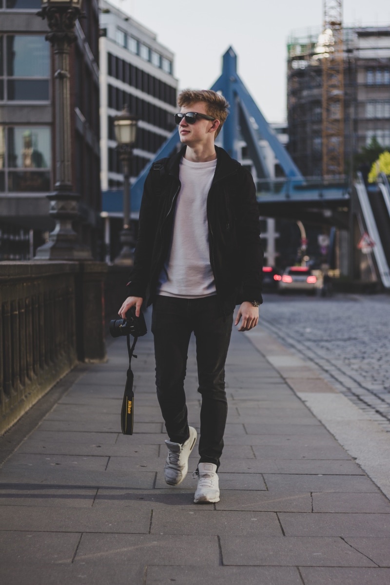architecture, building exterior, full length, front view, real people, city, 4K, caucasian Ethnicity, focus, standing, concrete road, man, built structure