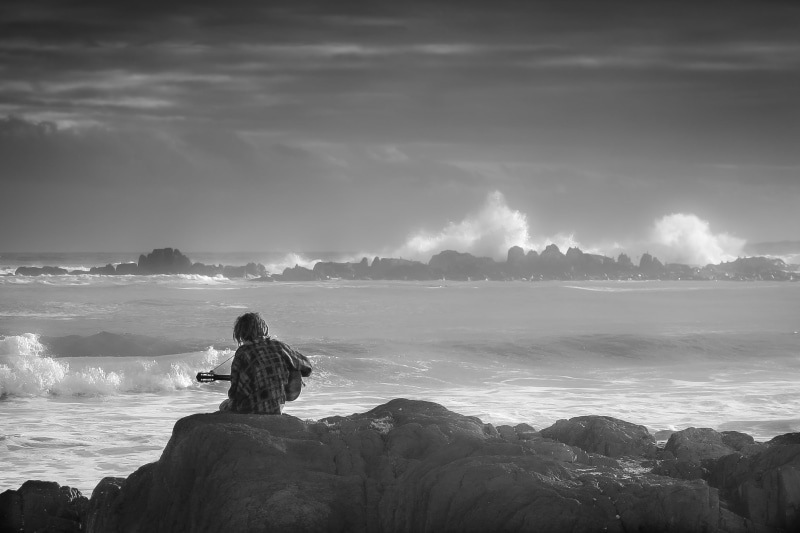 looking at view, mountain, contemplation, holding, solid, beauty in nature, nature, solo, guitarist, rock, pile, scenic, stones, sky, outdoors, guitar