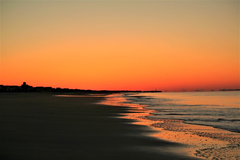 idyllic, dusk, horizon, horizon over water, beauty in nature, evening, romantic sky, clear sky, sea, orange color, outdoors, seascape, tranquil scene, land
