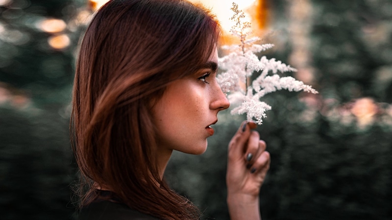 one person, profile view, headshot, redhead, beauty, holding, beauty in nature, adult, smelling, beautiful woman, young adult, hairstyle, human face, plant