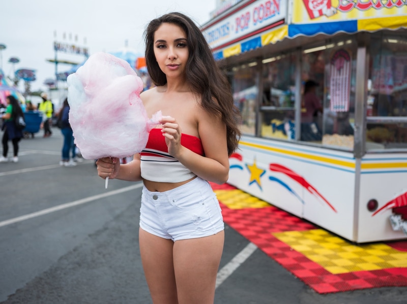 incidental people, holding, beauty, 720P, beautiful woman, standing, women outdoors, fair, jean shorts, one person, young women, long hair, adult, focus on foreground