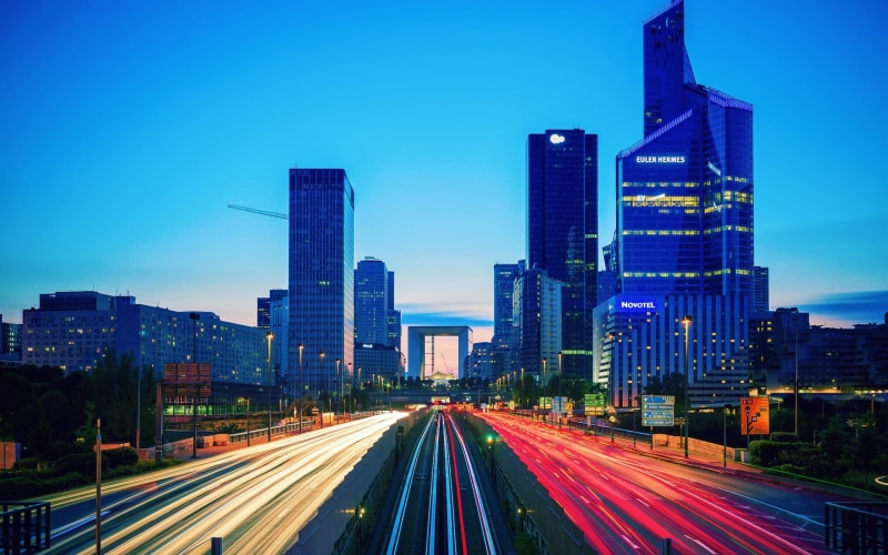 architecture, no people, timelapse, multiple lane highway, photo, building exterior, long exposure, city, road, outdoors, light trail, modern, office building exterior
