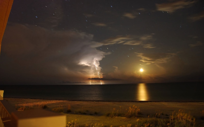 cloud - sky, land, remote, tv, 720P, screen, night, storm, sky, beauty in nature, horizon, tranquility, horizon over water, water, beach, lightning, reflection