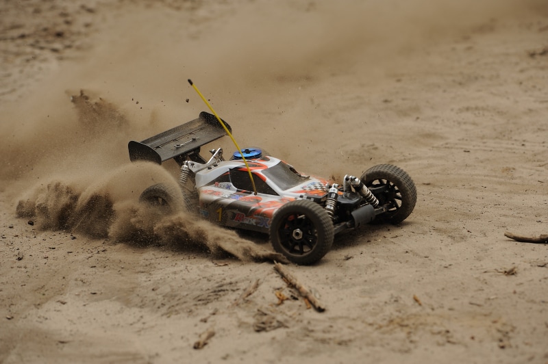 motorcycle, rc, toys, sand, white, dirty, toy, sports race, sports helmet, auto, car racing, drifting, land vehicle, competition, nature, car, remotely controlled