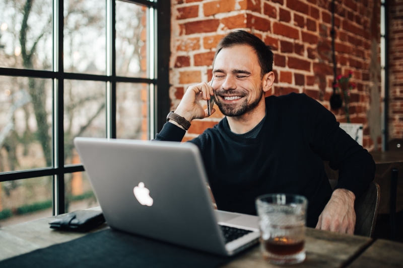 businessman, caucasian Ethnicity, front view, busy, table, young, restaurant, macbook pro, computer, cheerful, working, using Laptop, Modern, business
