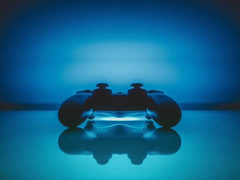 copy space, close-up, joystick, reflection, two people, gamepad, blue, colored background, 4K, board game, two objects, table, leisure activity, indoors