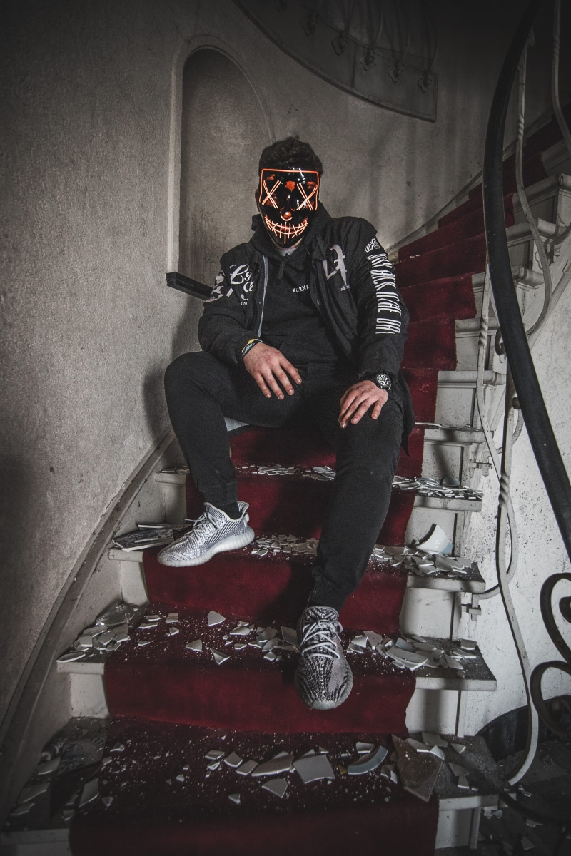 mask, clothing, men, lifestyles, model, ledmask, wall - building feature, urbex, fashion, front view, staircase, belgium, celebration, full length, canon