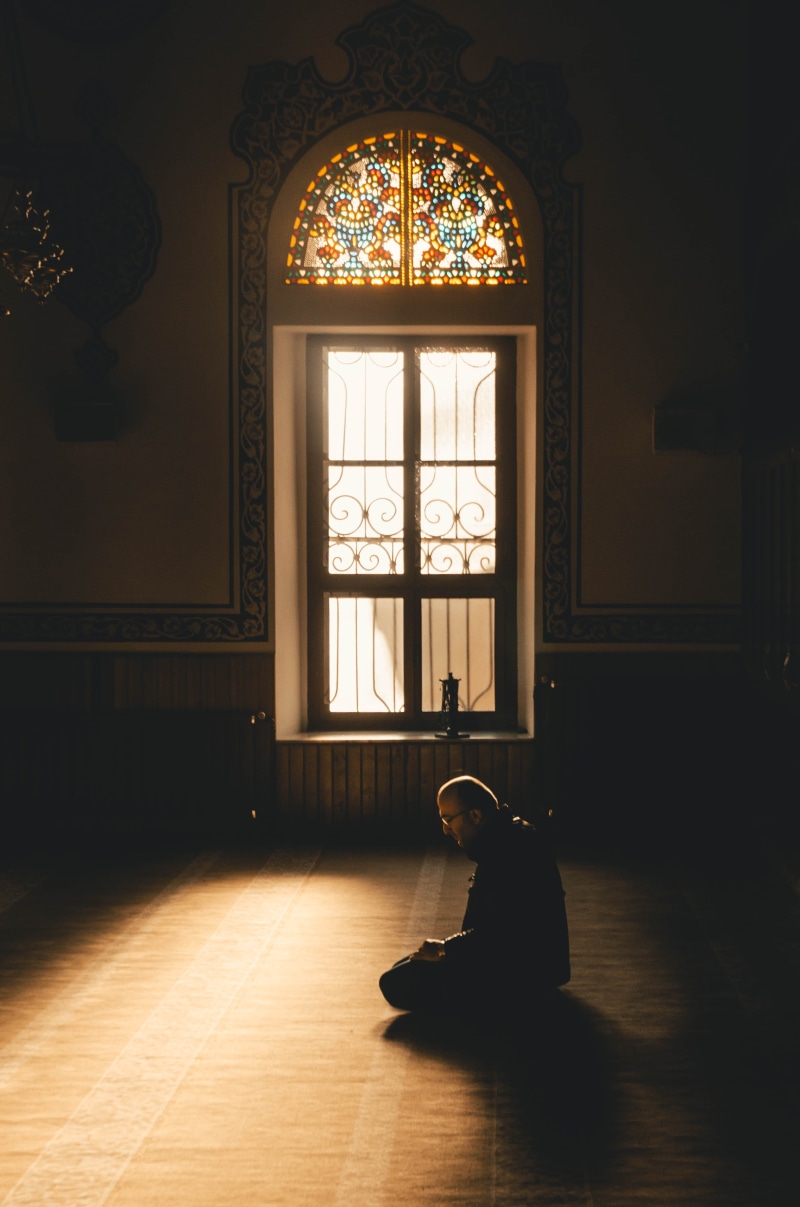 chandelier, built structure, adult, architecture, shadow, lighting equipment, religion, glass, church, building, glass - material, flooring, city, indoors