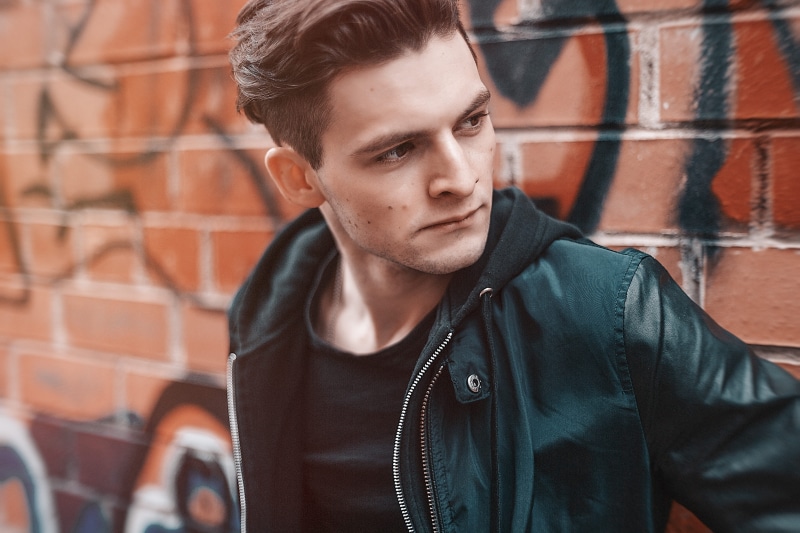 beautiful people, brick wall, wall, glamour, stylish, young men, one person, black leather jacket, street, young adult, casual clothing, close-up, architecture