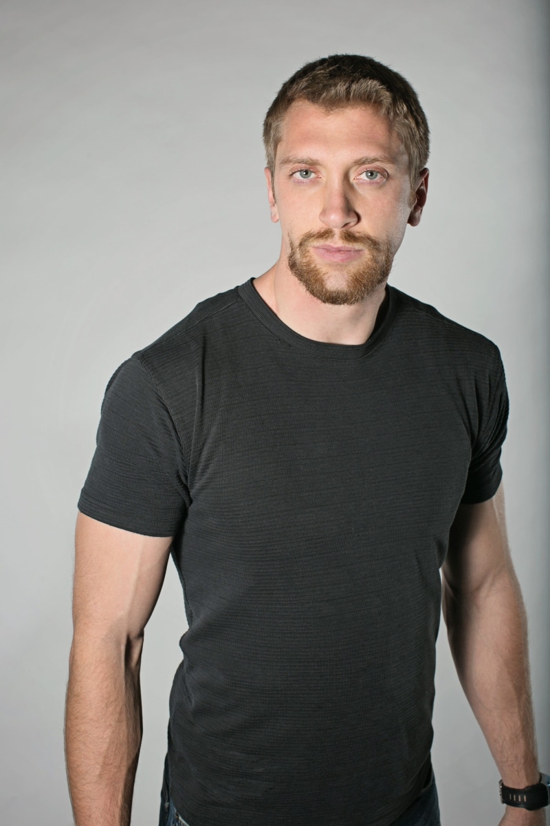 t, studio Shot, people, black, white background, t-Shirt, male model, one man only, facial hair, men, behind, confidence, strong, indoors, cancer, lark