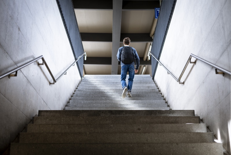 built structure, person, climbing, men, bhf biel, architecture, staircase, railing, biel, casual clothing, walking, denim, switzerland, indoors, real people