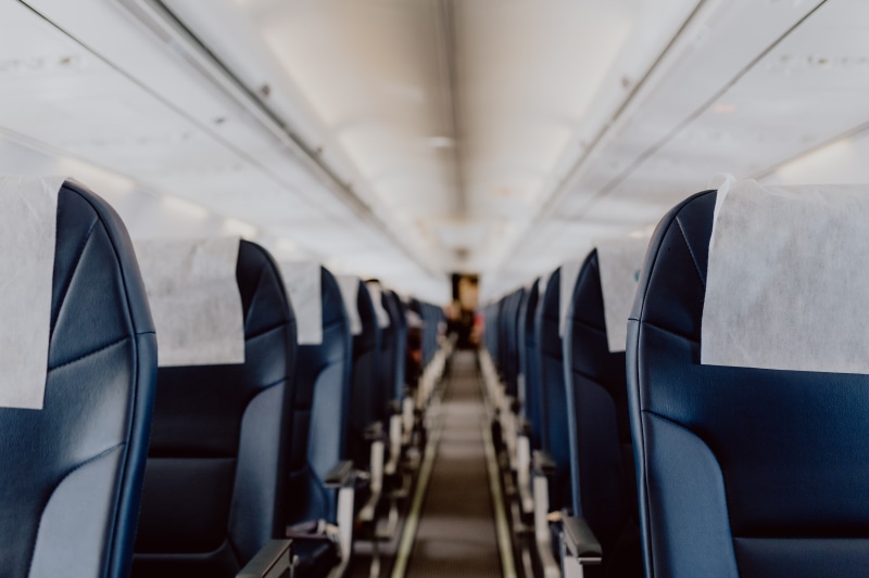 interior, aircraft, passenger cabin, cabin, vehicle seat, diminishing perspective, vehicle interior, ceiling, vanishing point, plane, aisle, mode of transportation