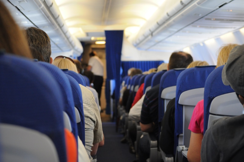 group of people, large group of people, airplane, journey, public transportation, seats, people, mode of transportation, ceiling, aisle, airplane seat