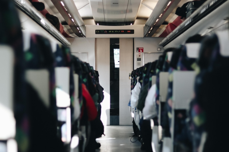 seats, white, grey, sitting, vehicle interior, focus, commercial, selective, indoors, group of people, japan, air vehicle, door, commute, seating, entrance