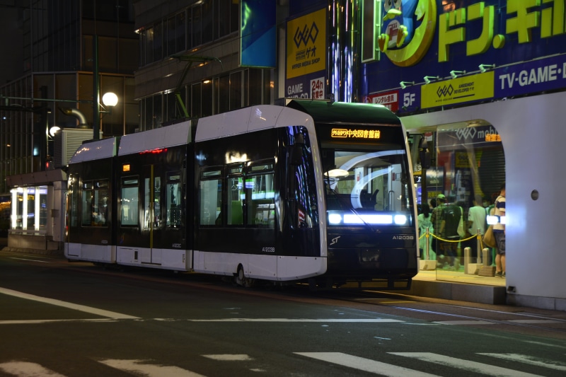 Train, outdoors, 5K, modern, building exterior, no people, japanese, cable, urban, near, rail transportation, station, railroad, cable car, bus, railway