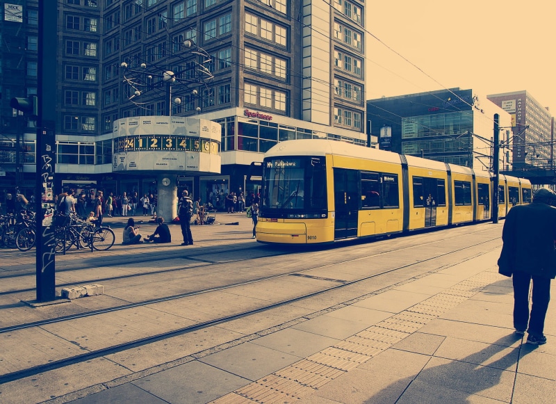 city life, rail transportation, people, street, concrete, transportation, land vehicle, modern, railroad track, selective, office, group of people, architecture