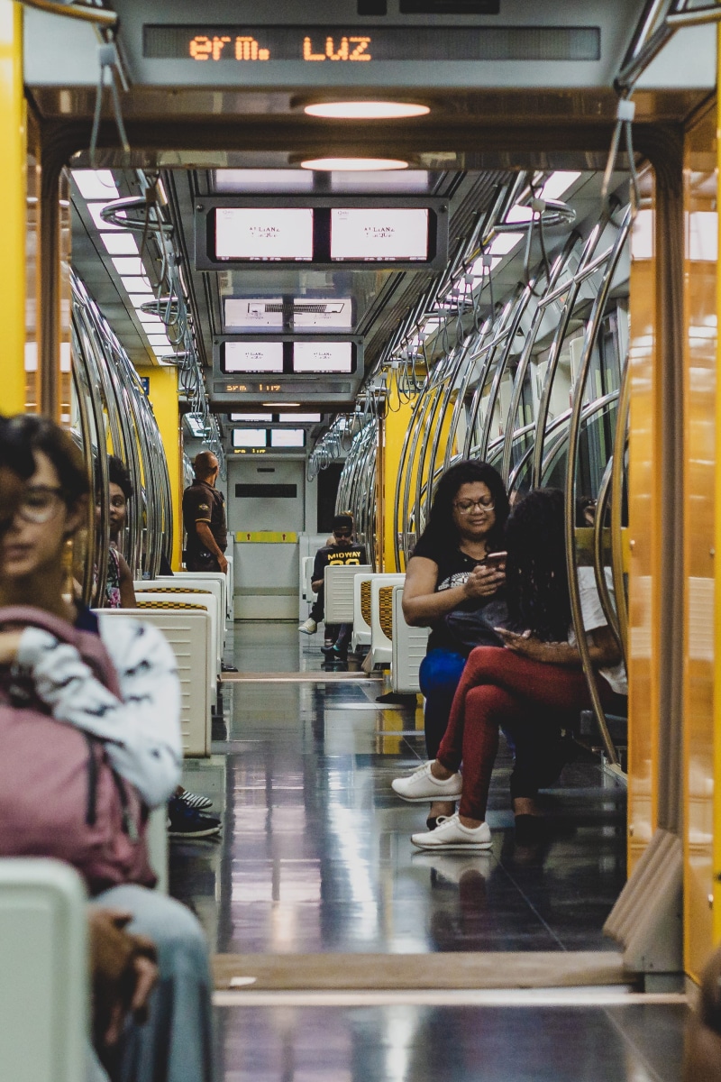 looking at camera, lights, transportation system, vehicle interior, young adult, portrait, illuminated, indoors, train, transportation, modern, public transportation