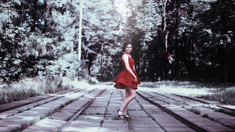 glamour, clothing, youth, outdoors, red, portrait, female, makeup, transportation, fashion, red dress, posture, model, only women, railroad track, standing