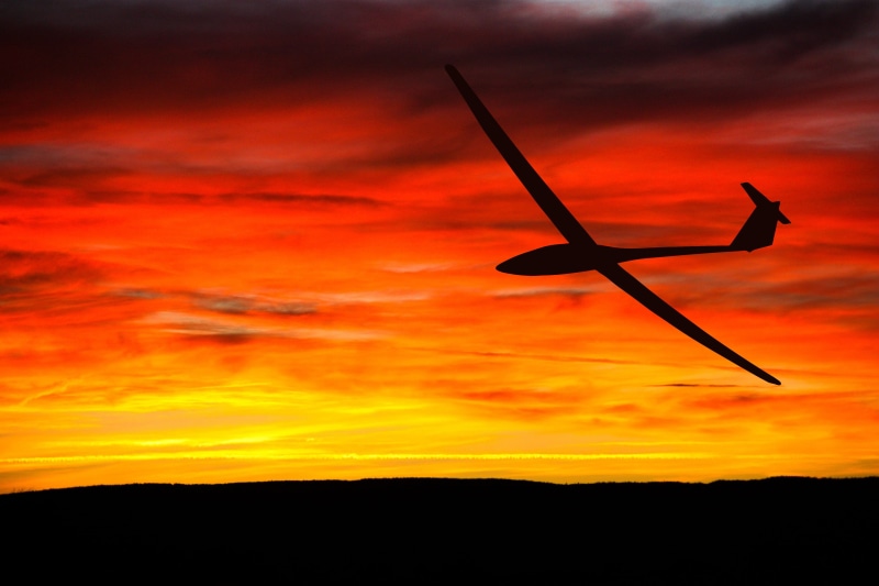 cloud - sky, no people, airplane, tranquil scene, dom, outdoors, gliding, environment, travel, transportation, trip, flight, orange, idyllic, aviation