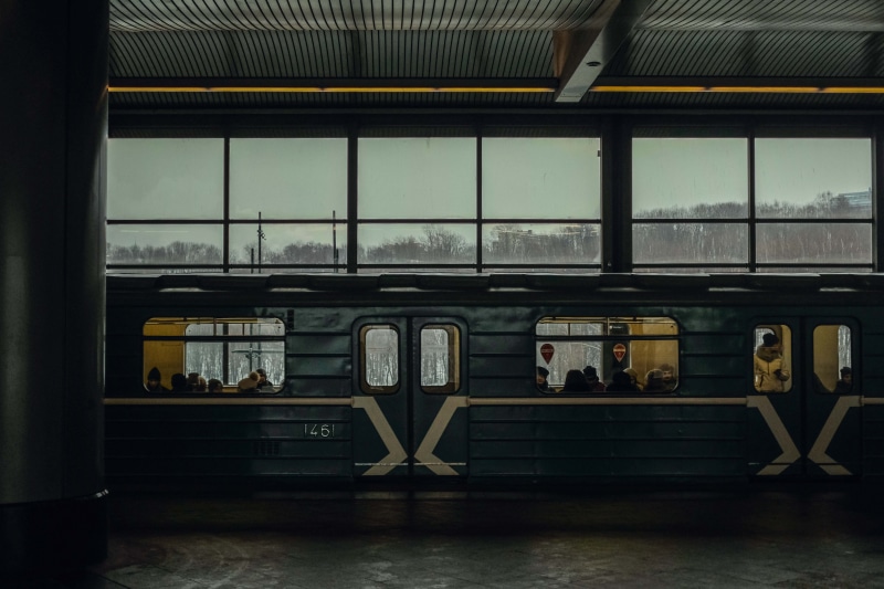 glass - material, train, waiting, mode of transportation, passenger, transparent, public transportation, men, subway, architecture, transportation, indoors
