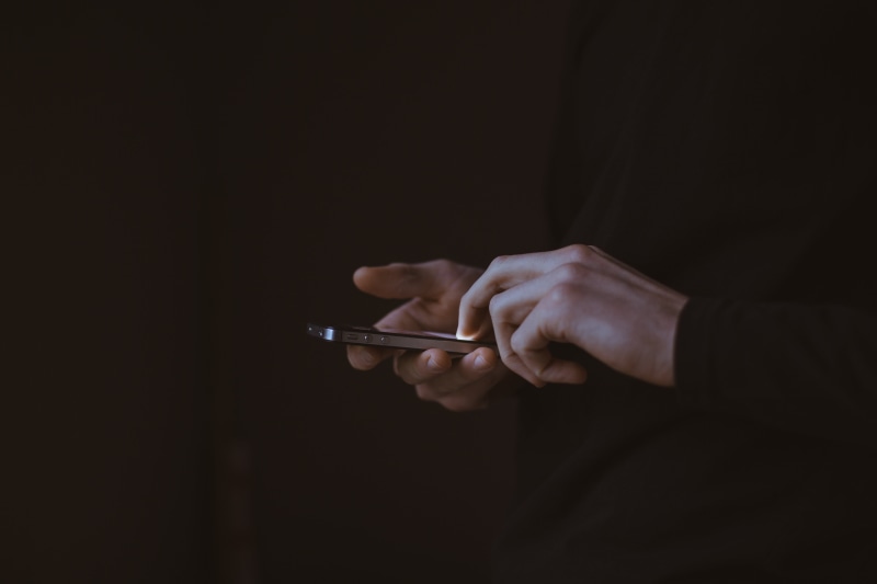 one Person, black, human body part, typing, aiming, studio shot, wireless Technology, indoors, human Hand, close-up, iphone, holding, technology, handgun