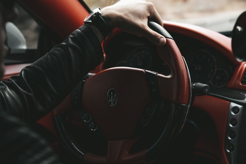 real people, men, focus on foreground, one person, 5K, gauge, human, finger, gearshift, land vehicle, automobile, vehicle, car interior, mode of transportation