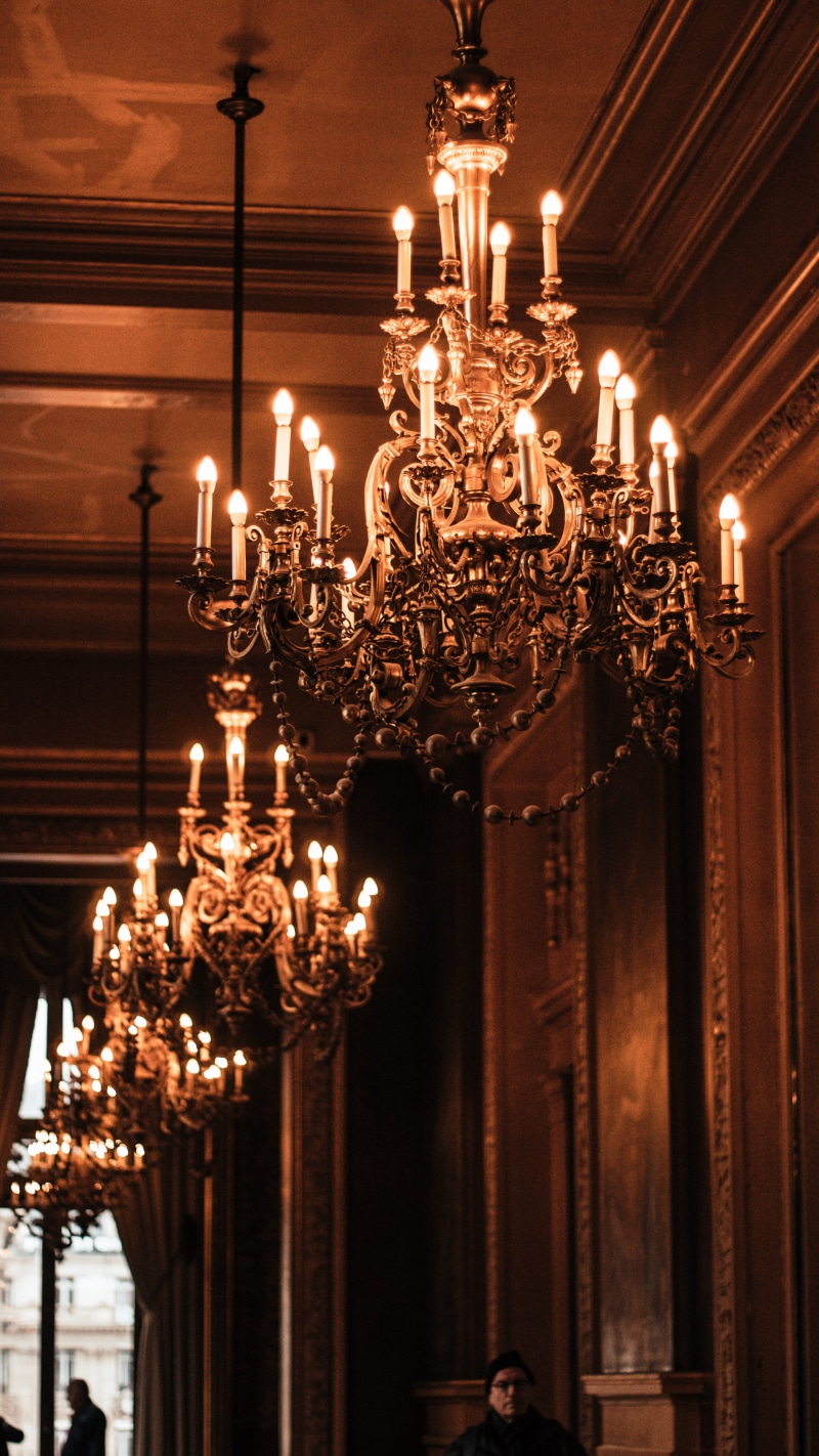 low angle view, ceiling, glowing, black, paris, ornate, lighting equipment, wealth, chandelier, illuminated, lamp, architecture, decoration, luxury, interior