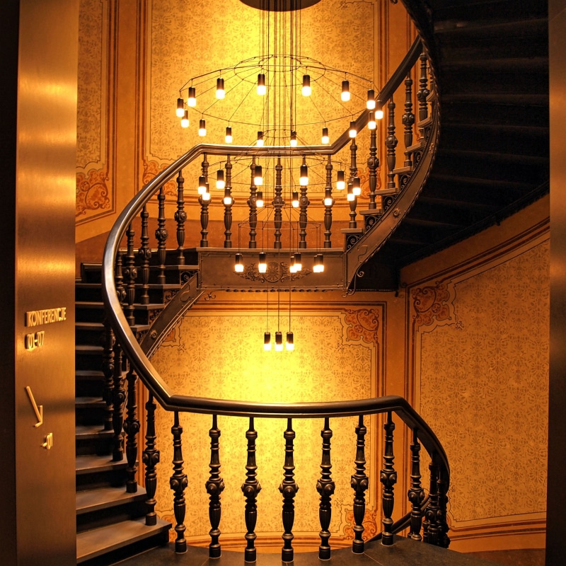 chandelier, home interior, illuminated, indoors, wealth, lighting equipment, decoration, handrail, hotel, spiral staircase, staircase, ornate, mansion