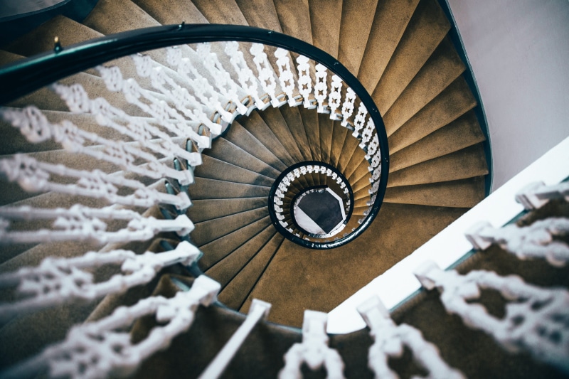 round, no people, swirl, beacon, metal, directly above, construction, shape, spiral, indoors, view, steps and staircases, building, tall, selective focus