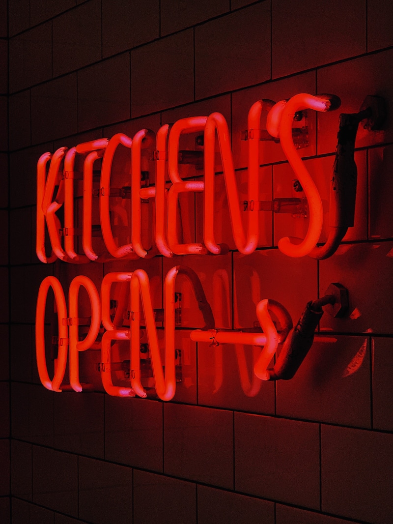 commercial sign, no people, nightlife, light, communication, musical instrument, symbol, hanger, architecture, store, red, weaponry, alphabet, information
