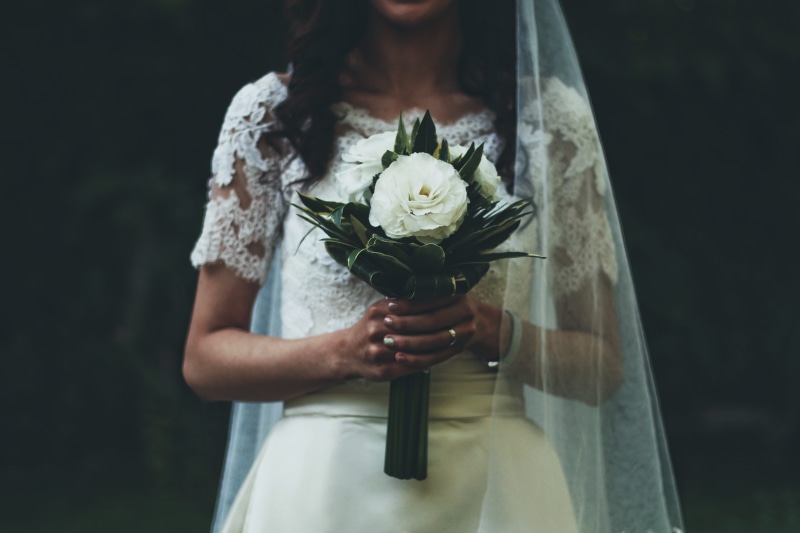 person, hand, veil, midsection, event, bouquet, outdoors, holding, newlywed, fragility, nature, portrait, bride, wearing, freshness, beauty in nature, dress