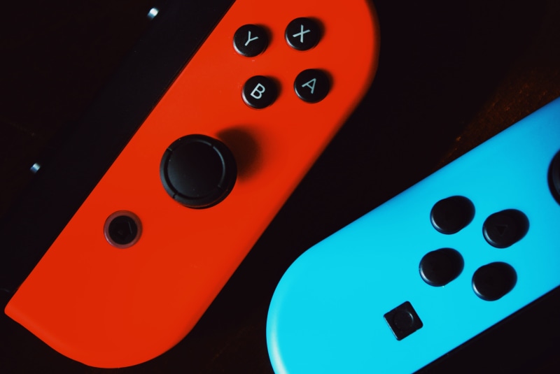 joy-cons, close-up, black, luck, surface, nintendo switch, studio shot, arts culture and entertainment, black background, leisure activity, number, nintendo