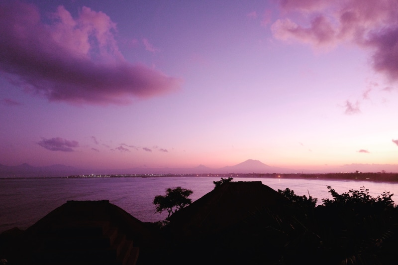 ocean, sunrise, dusk, cloud - sky, beauty in nature, clouds, water, scenics - nature, land, mountains, tranquil scene, four seasons resort bali at jimbaran bay