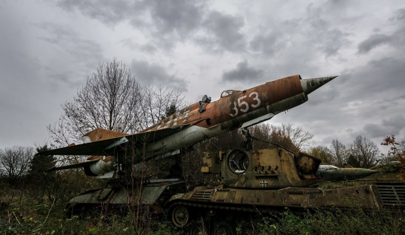 no people, plant, nature, military, armored tank, transportation, cloud - sky, field, the past, cannon, bare tree, tree, land, sky, vehicle, outdoors, MiG-21