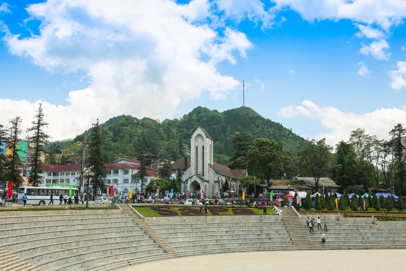 plant, crowd, built structure, tt. sa pa, women, outdoors, art and craft, nature, real people, tree, religion, travel, city, architecture, building exterior