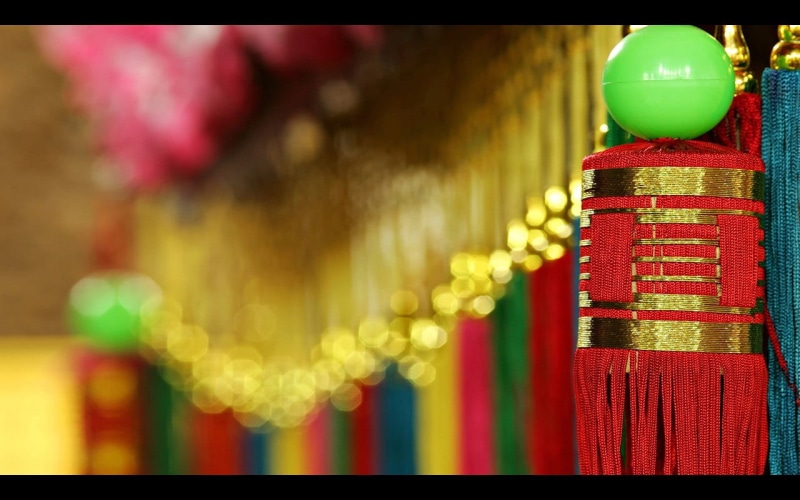 hanging, night, depth of field, auto post production filter, decorations, yellow, chinese new year, close-up, red, human representation, focus on foreground