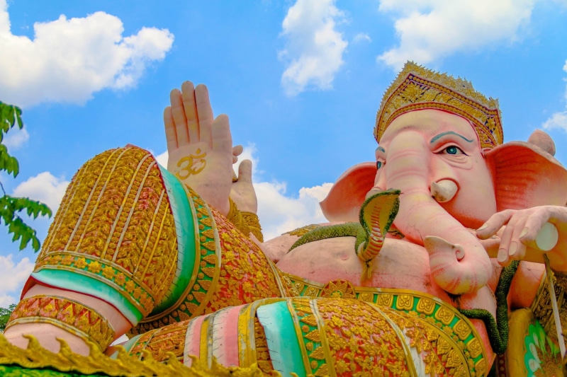 statue, the god of success, no people, outdoors, religion, spirituality, famous Place, temple - Building, low angle view, art and craft, built structure