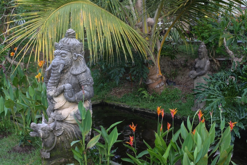 representation, female likeness, culture, asia, green color, god ganesh, male likeness, outdoors, religion, no people, statue, 2K, craft, creativity, day