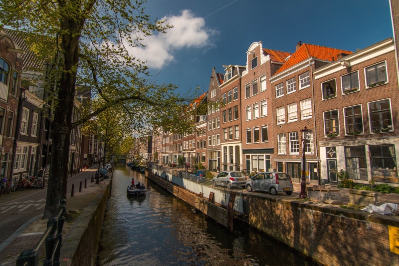 waterway, floats, nautical Vessel, center, reflection, vehicles, tile, city, incidental people, parked, outdoor, channel, watercraft, beautiful, house