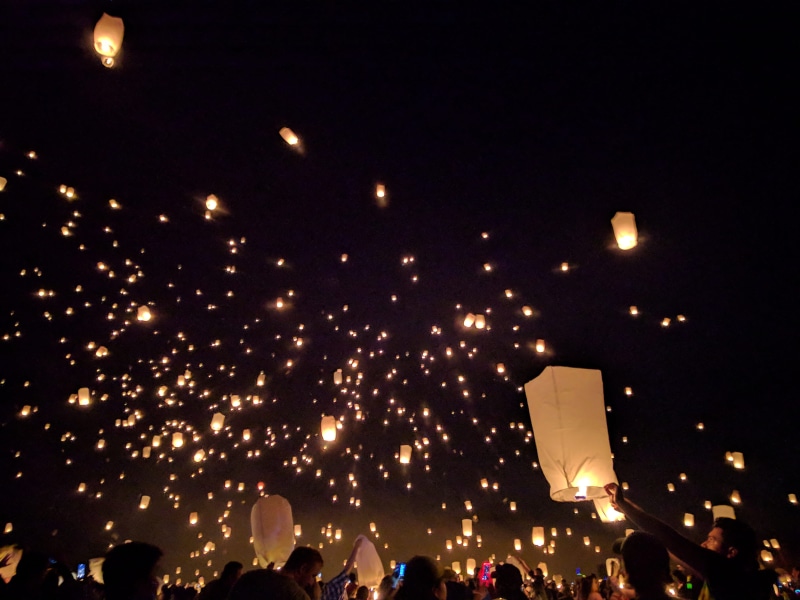 firework - man made object, outdoors, night sky, real people, event, lanterns, arts culture and entertainment, nature, lighting equipment, architecture