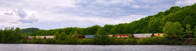 sky, shipment, cloud - sky, horizontal, scenics - nature, railway, locomotive, heavy, service, no people, long shot, tree, architecture, loading, Freight Train
