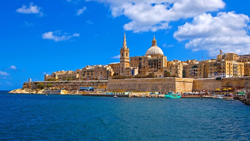passenger craft, religion, city, cityscape, water, blue, high, cloud - sky, built structure, building exterior, rise, tourism, tower, sky, nautical vessel