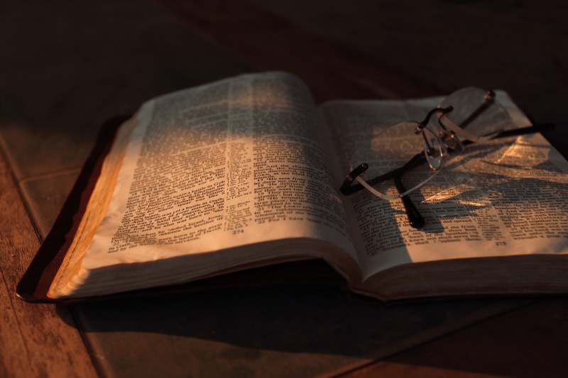 no people, expertise, religion, antique, still life, read, eyeglasses, glasses, high angle view, book, old, wisdom, page, shadow, text, spiritual, gray