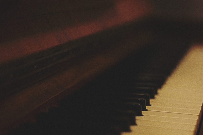 indoors, brown, song, key, focus, wolfgang amadeus mozart, copy space, no people, photography, musical instrument, absence, grand piano, arts culture and entertainment