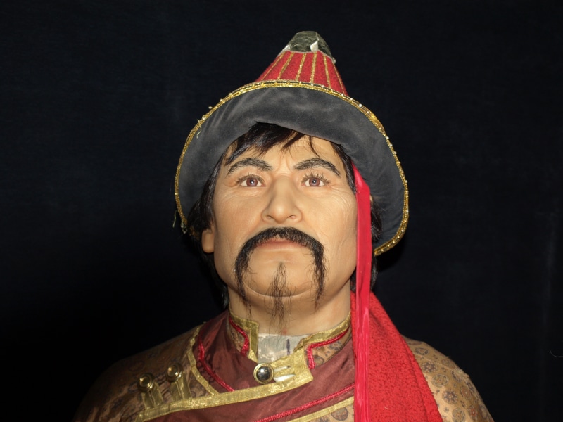 clothing, human face, temujin, adult, beard, black background, mongolia, gold colored, religion, hat, portrait, wax figures, genghis khan, facial hair