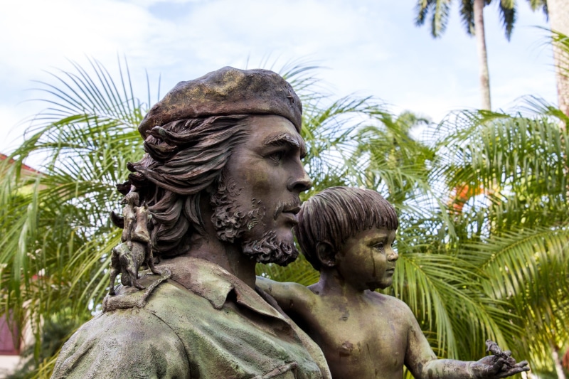 creativity, outdoors, representation, daytime, trees, architecture, near, man, tree, tropical climate, cuban revolution, headshot, human representation