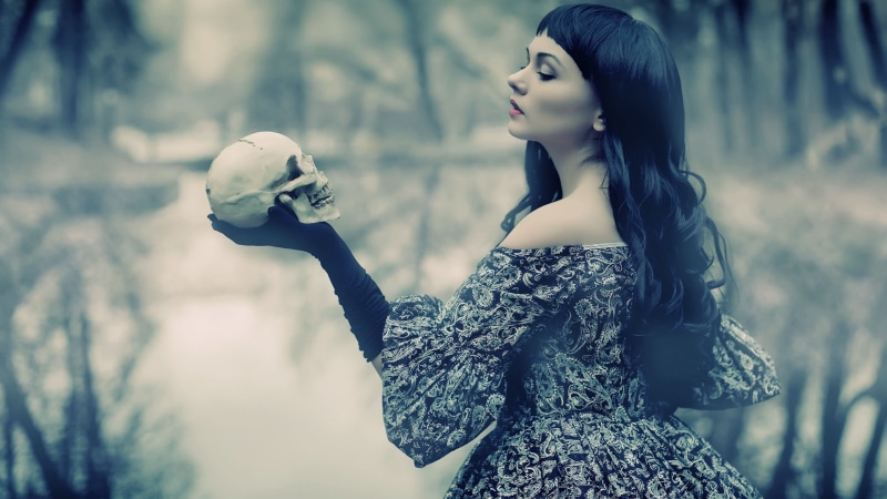 airbrushed, side view, skull, black gloves, holding, profile view, 2K, young adult, model, brunette, women outdoors, open mouth, young women, nature, one person
