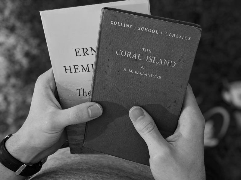 human hand, real people, hemingway, black and white, school books, focus on foreground, hand, hd images, human body part, travel, text, lifestyles, books