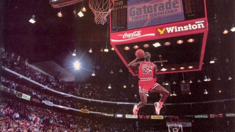 full length, stadium, vitality, men, competition, clothing, crowd, motion, night, sport, one person, adult, effort, Michael Jordan, jumping, athlete, illuminated