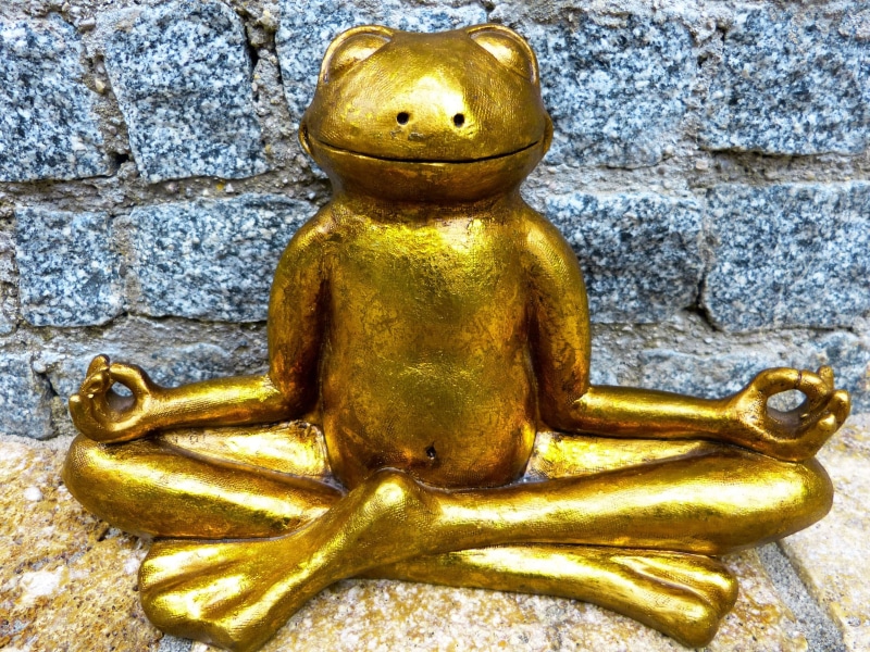 focus on foreground, inner calm, yoga, gold colored, day, architecture, statue, figurine, golden, wall - building feature, male likeness, sculpture, religion